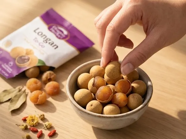 Dragon Herbs Longan To-Go Sample, woman's hand selecting golden longan fruit