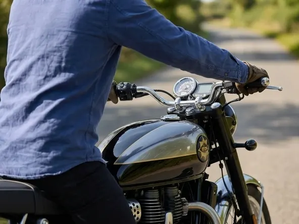 Win a FREE BSA Gold Sport 650 Motorcycle Worth $7,995, hands gripping handlebars ready to ride