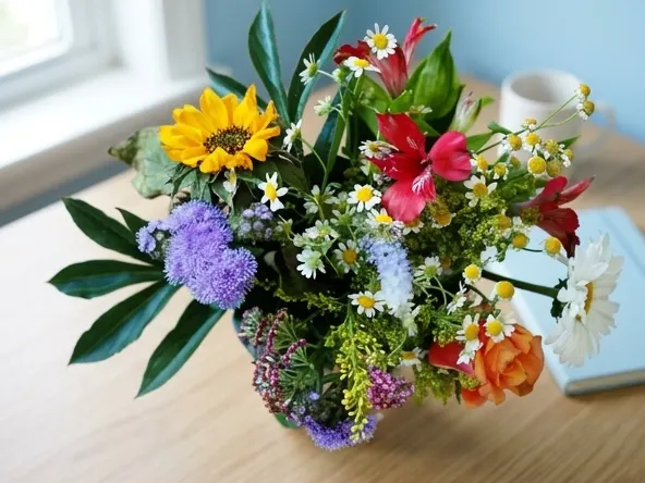 File a Claim in the Teleflora TCPA Settlement, product displayed on home office desk